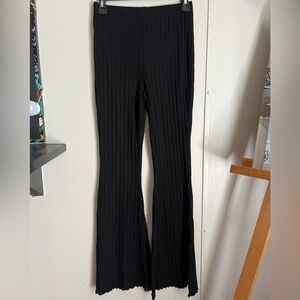 Black. Flared loose pants. Wit black tube top